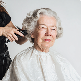 Stylist finishing a haircut
